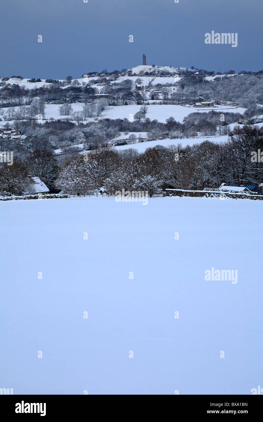 Snow in Honley fields and distant Jubilee Tower on Castle Hill, Huddersfield, West Yorkshire, England, UK. Stock Photo