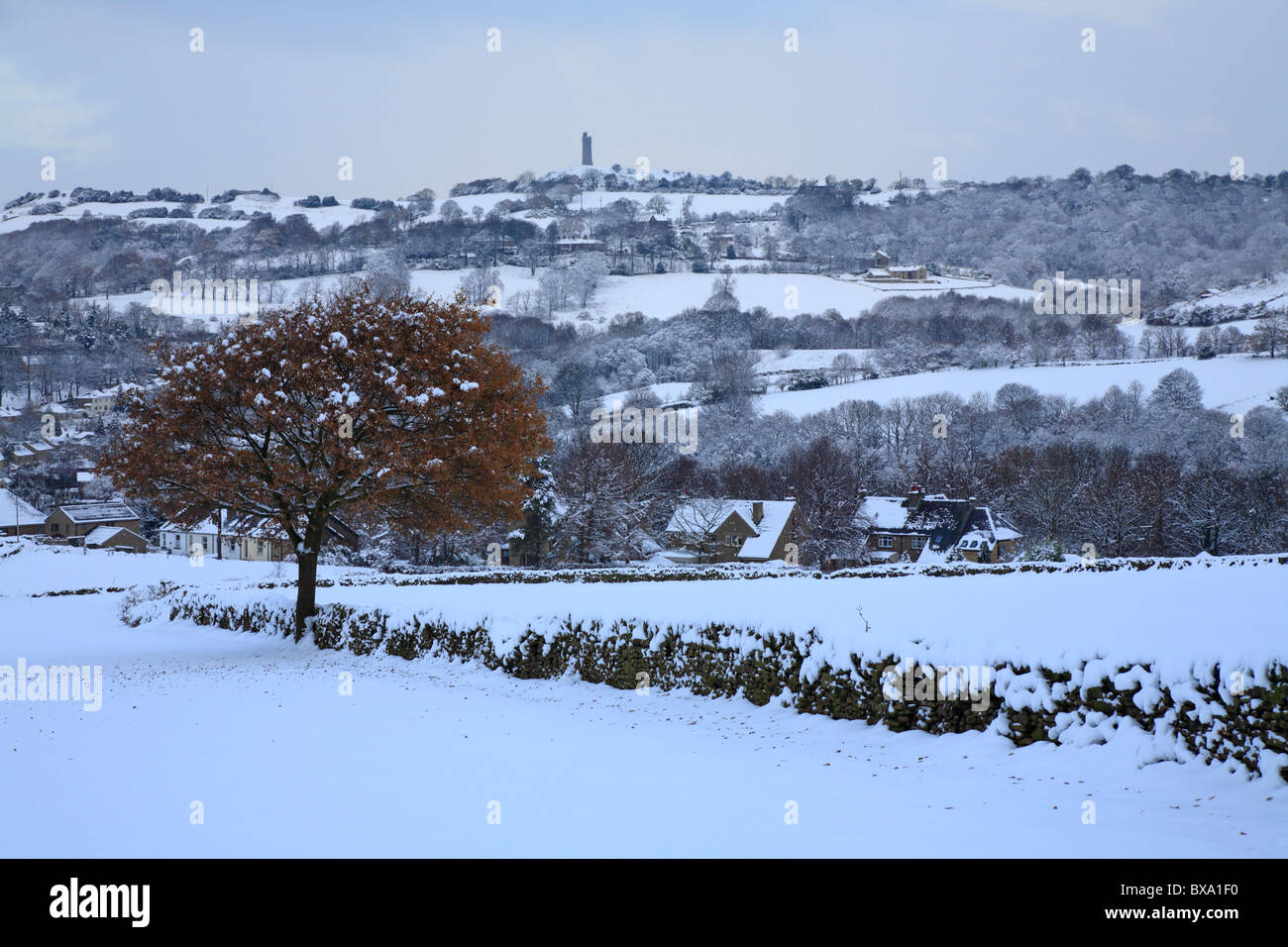 Snow in Honley fields and distant Jubilee Tower on Castle Hill, Huddersfield, West Yorkshire, England, UK. Stock Photo