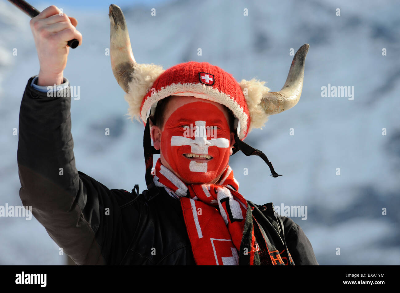 A Swiss fan with real horns ,during a ski racing Stock Photo