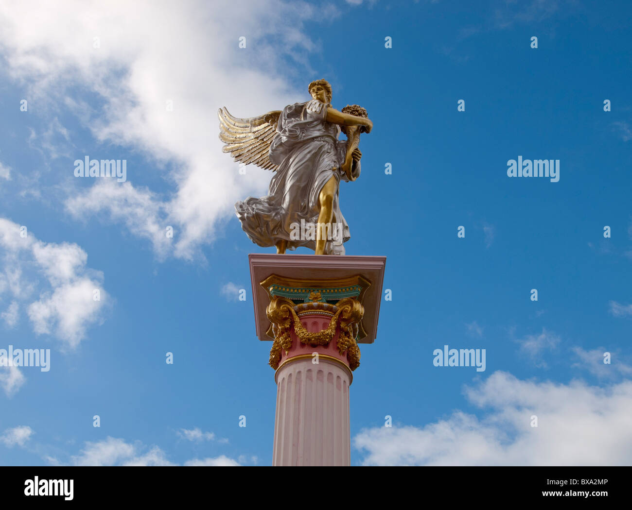 The greek or roman angle with wings on the high column garden statues Stock Photo