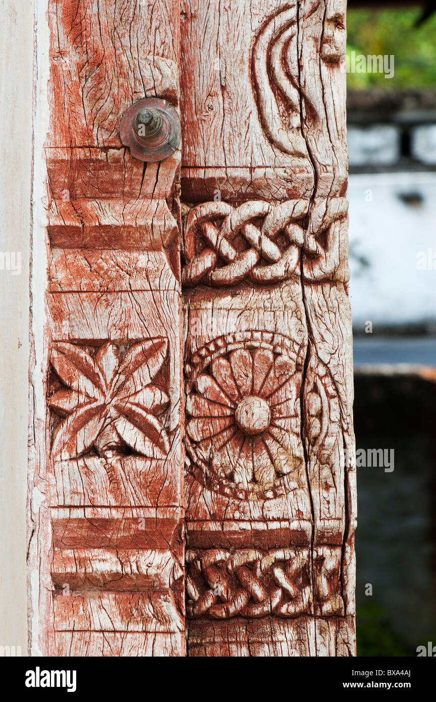 Indian carved wooden door frame with flowers and cektic knotwork. Andhra Pradesh, India Stock Photo