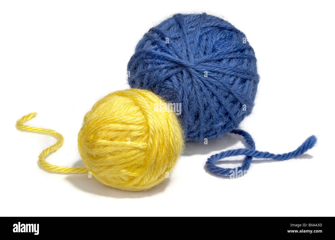 blue and yellow yarn balls photographed on a white background Stock