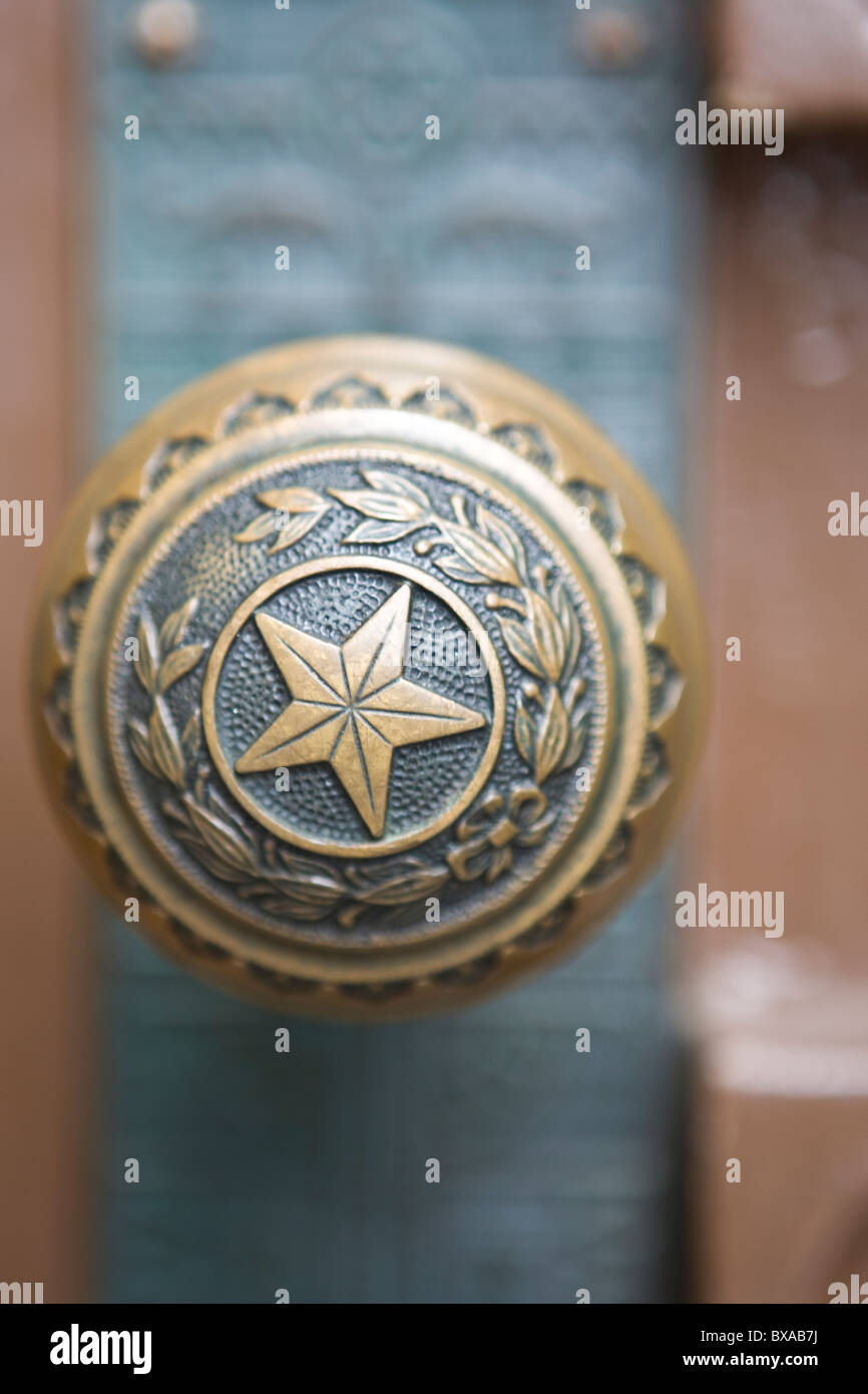 Capitol star design on bronze door knobs at Texas Capitol building Stock Photo