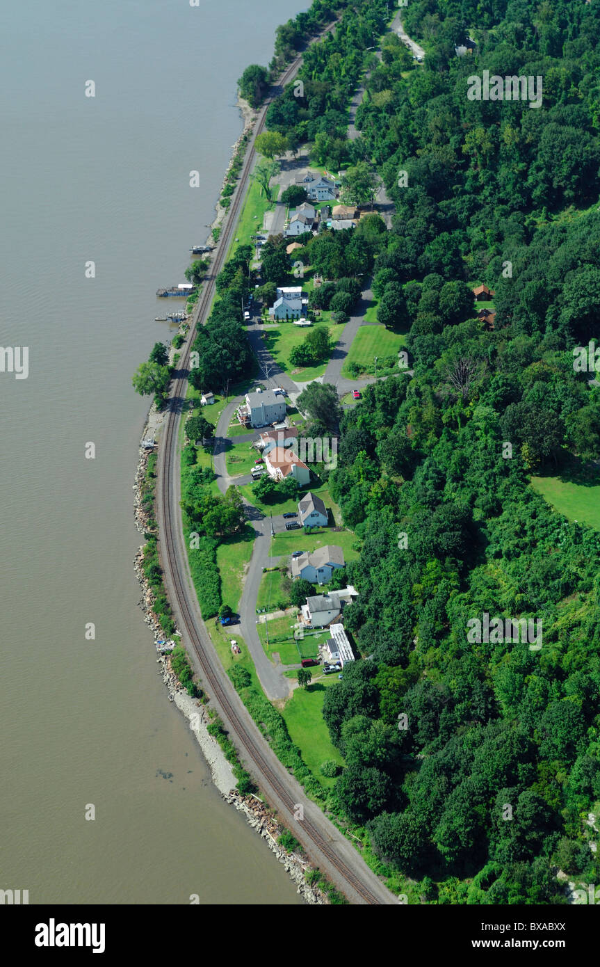 Aerial view of isolated houses on Hudson river side during summertime
