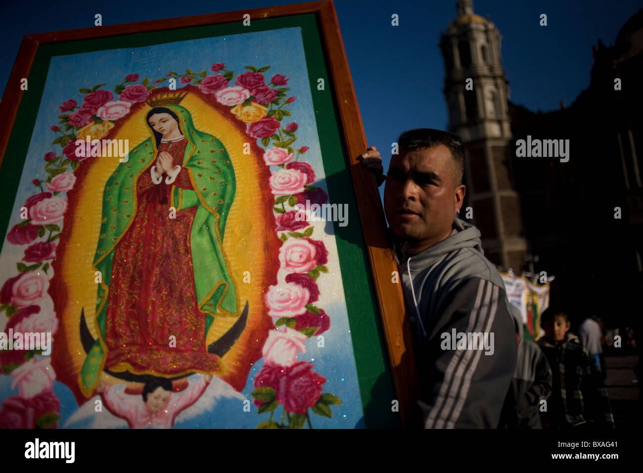 A pilgrim carries an image of the Our Lady of Guadalupe in Mexico City Stock Photo Alamy