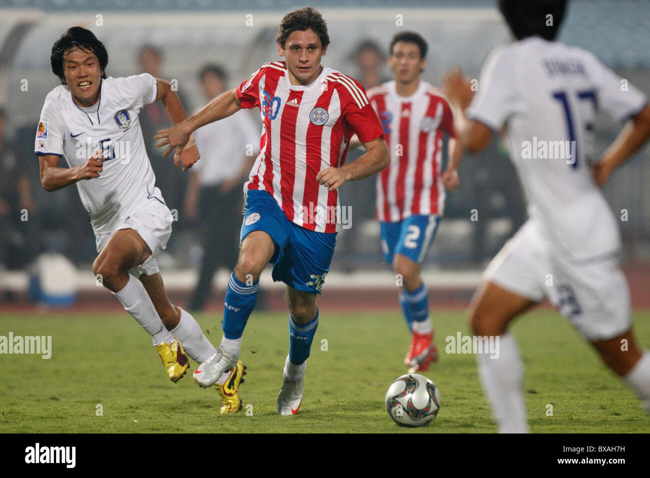 Luis Caballero of Paraguay (20) controls the ball against South Korea during a 2009 U-20 World Cup round of 16 match Oct 5, 2009 Stock Photo