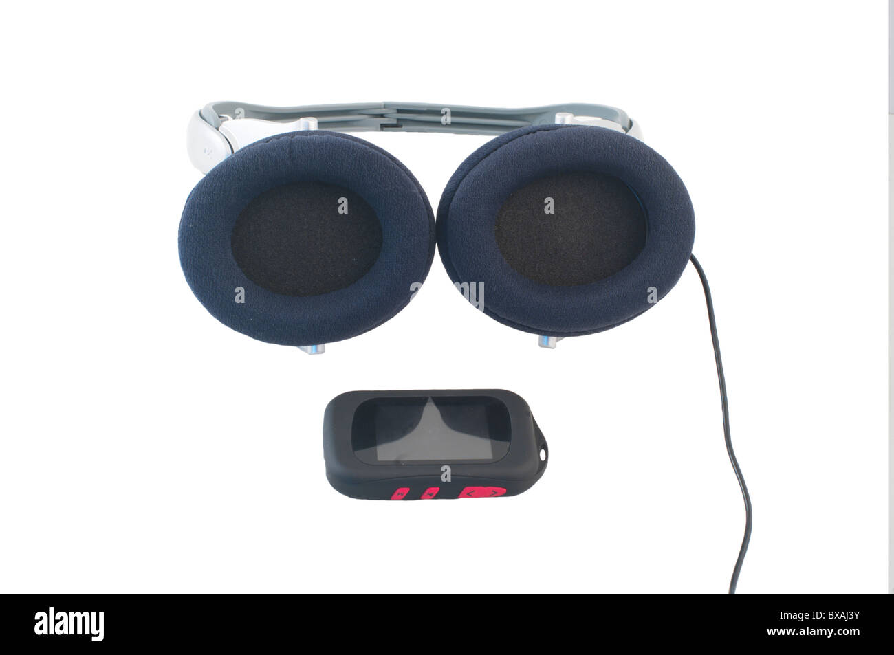 Player and ear-phones on a white background Stock Photo - Alamy