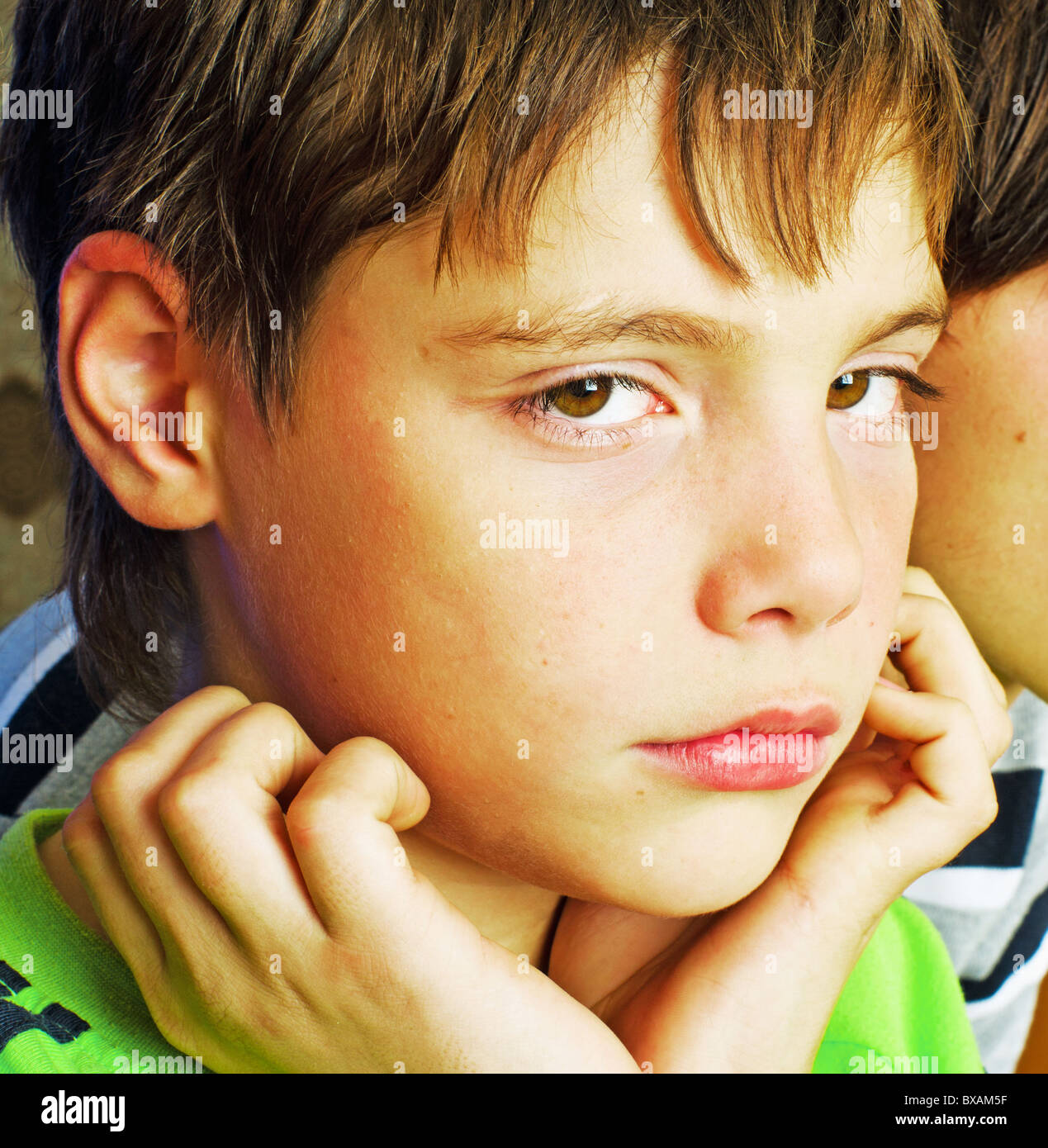Boy jura The sad boy looks having leant against hands Stock Photo - Alamy