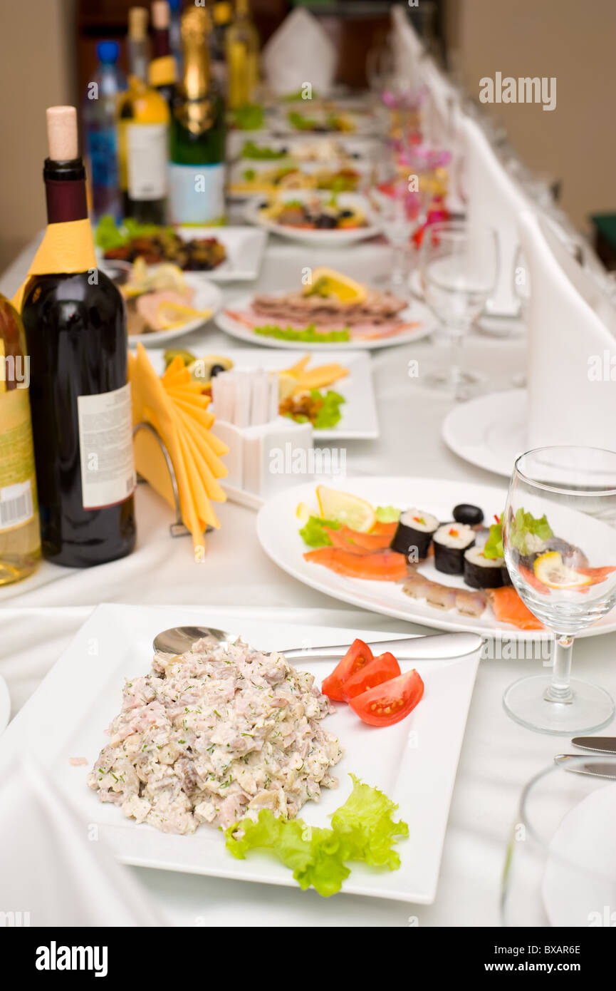 laid table with tableware and dishes for banquet Stock Photo - Alamy