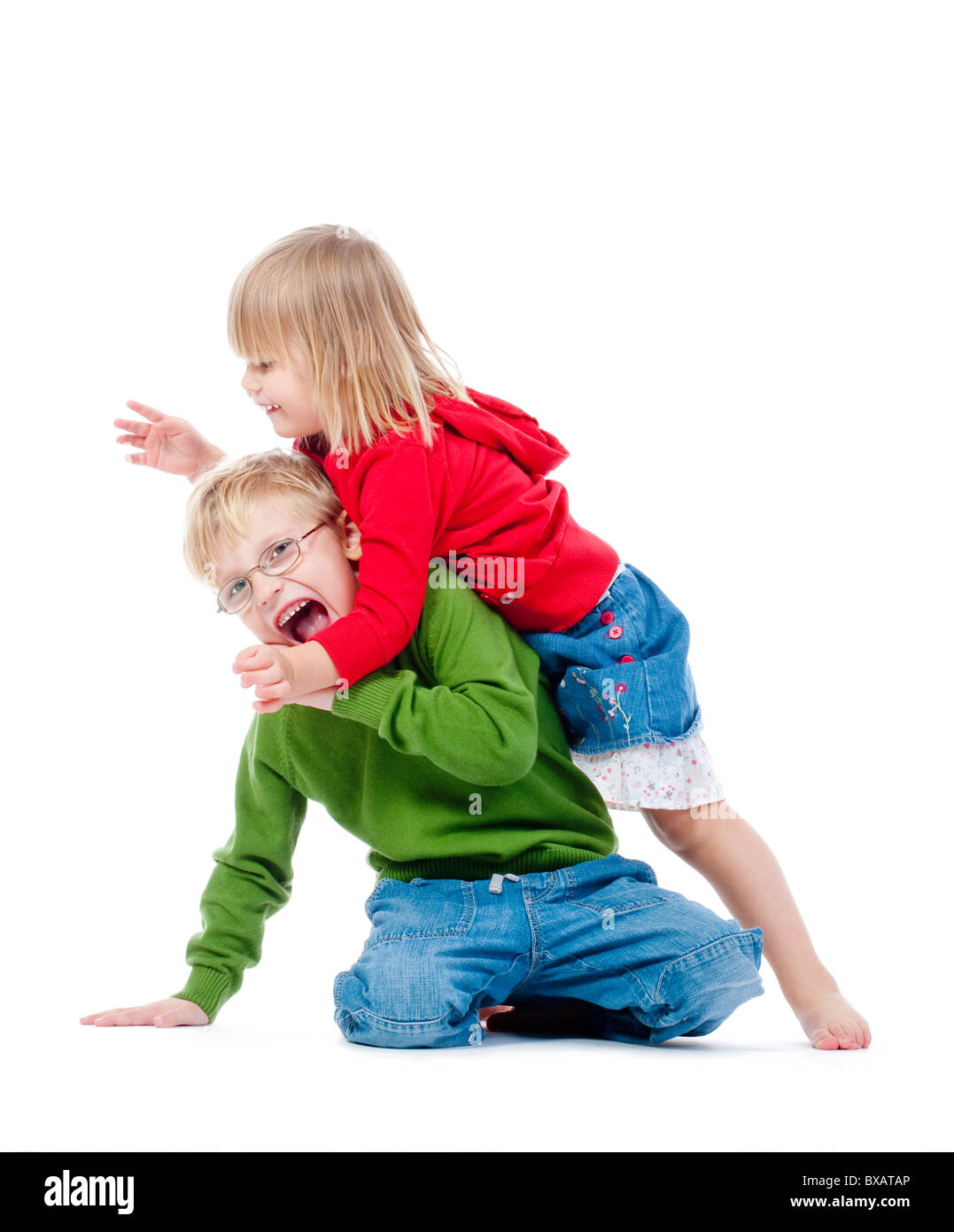 two young siblings fooling around with each other - isolated on white ...