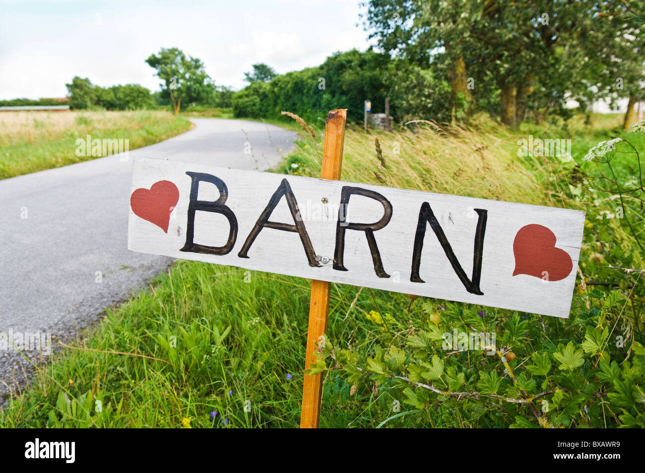 Sign with text barn next to country road Stock Photo
