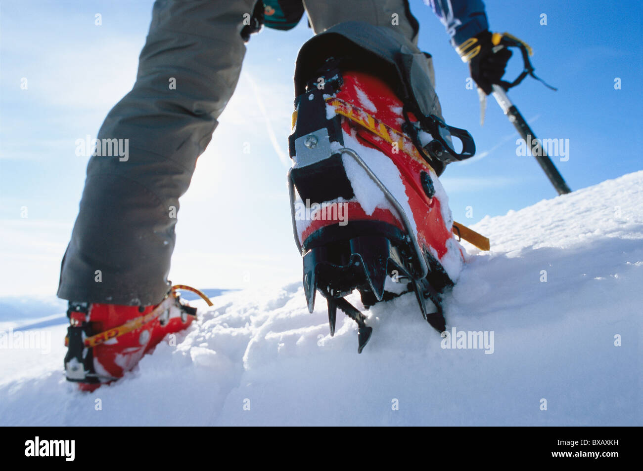 Low section of person wearing crampons Stock Photo