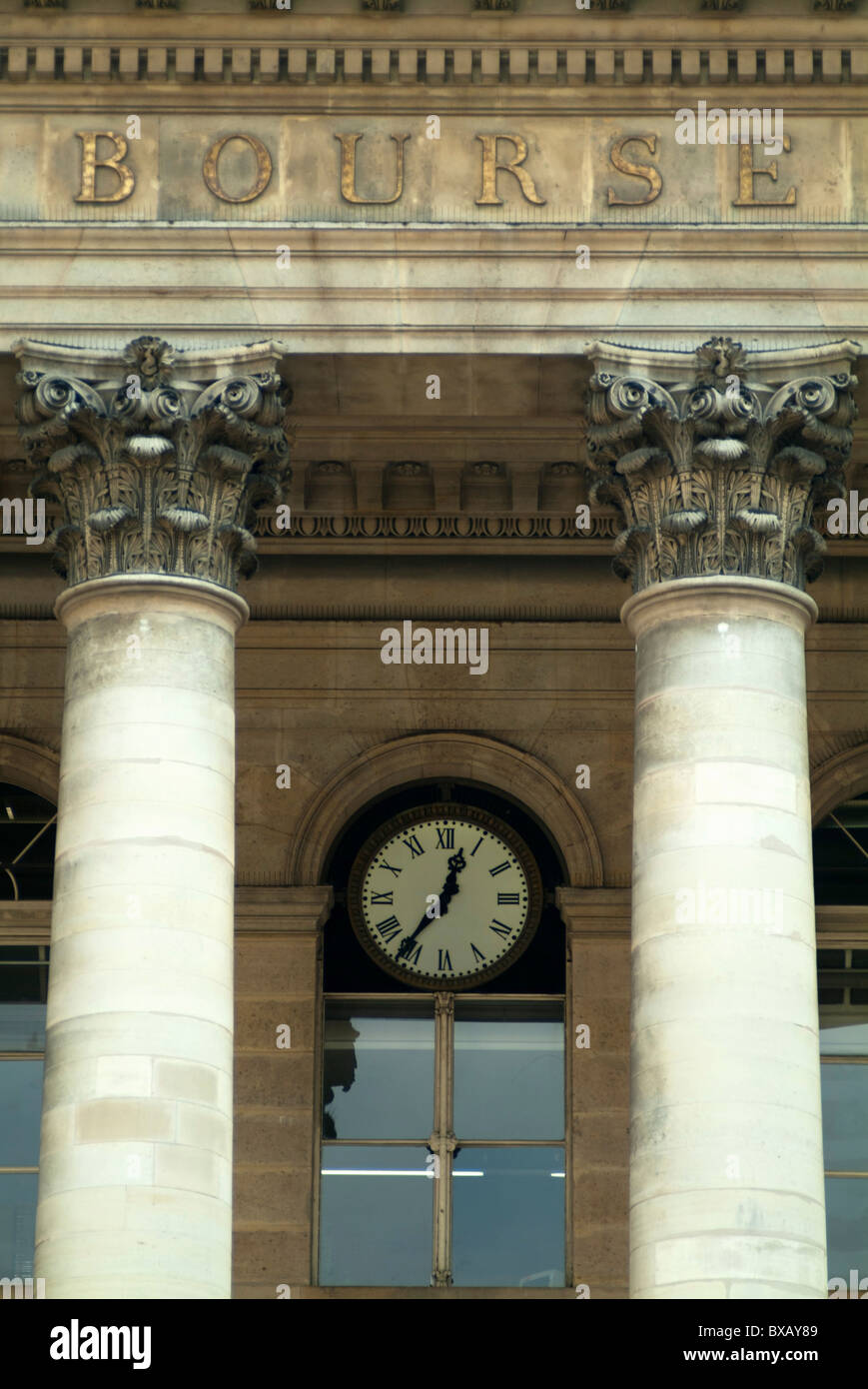Windows and ornate columns on the outside of Paris Bourse (Stock Exchange Building), Paris, France. Stock Photo