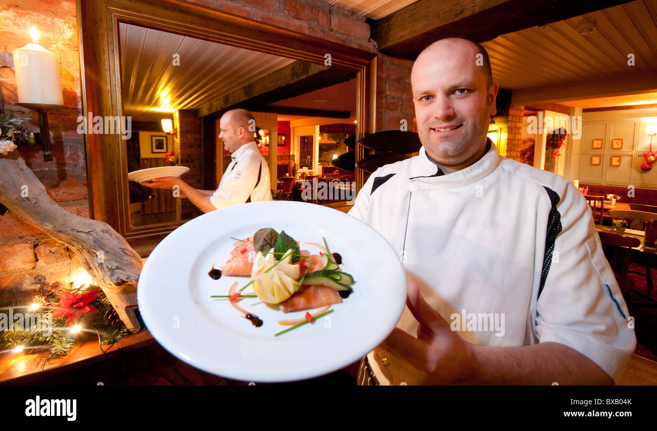 Chef holding a prepared starter Stock Photo