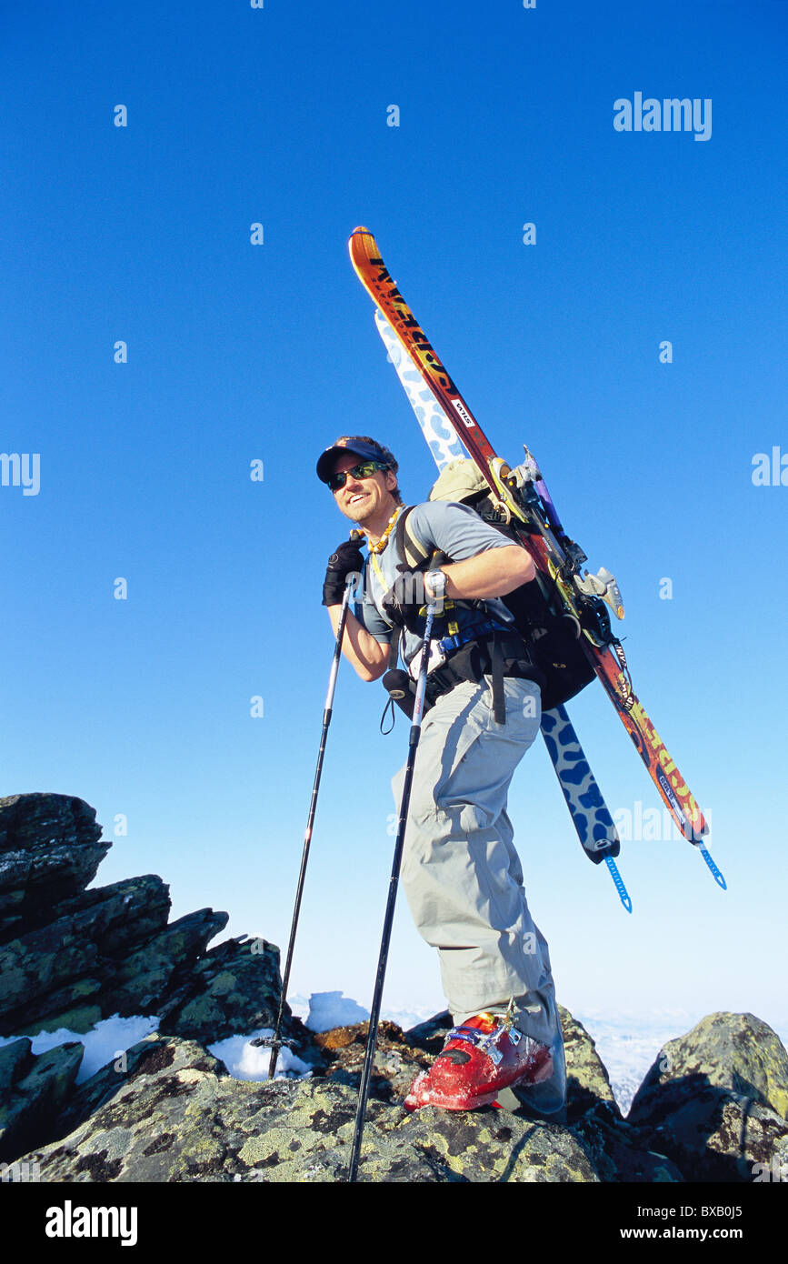 Telemark skier standing on mountain peak Stock Photo Alamy