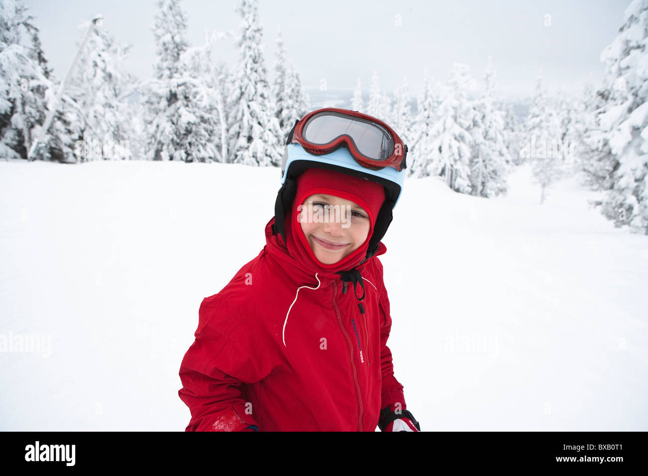 Boy playing on snow Stock Photo