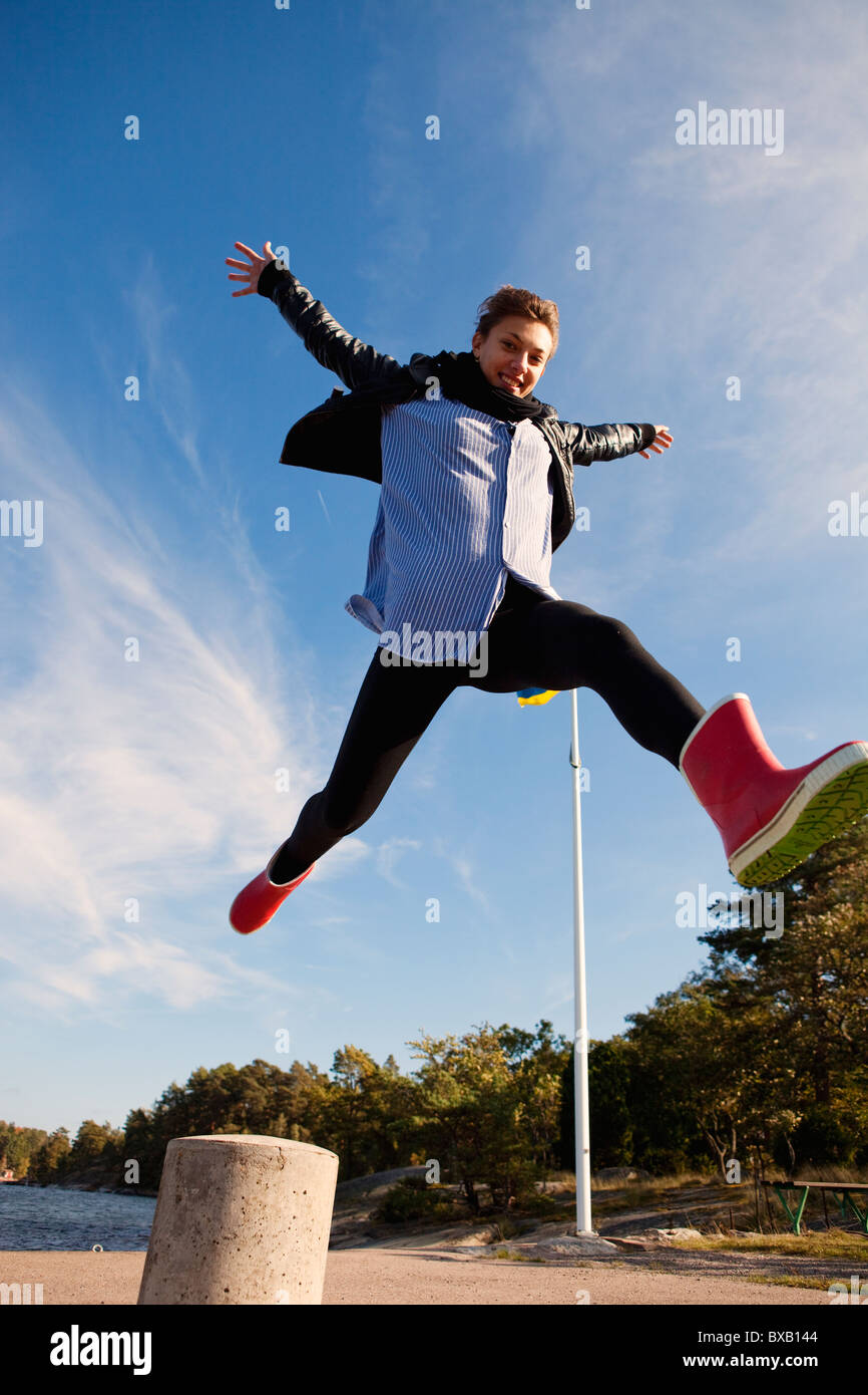 Young woman jumping Stock Photo