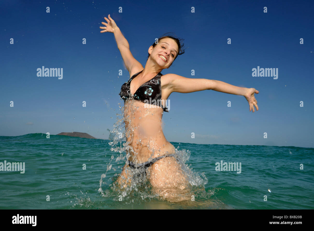 Young woman in the sea, symbolic image for vitality, lust for life, Playa Bajo Negro beach, Corralejo, Fuerteventura Stock Photo