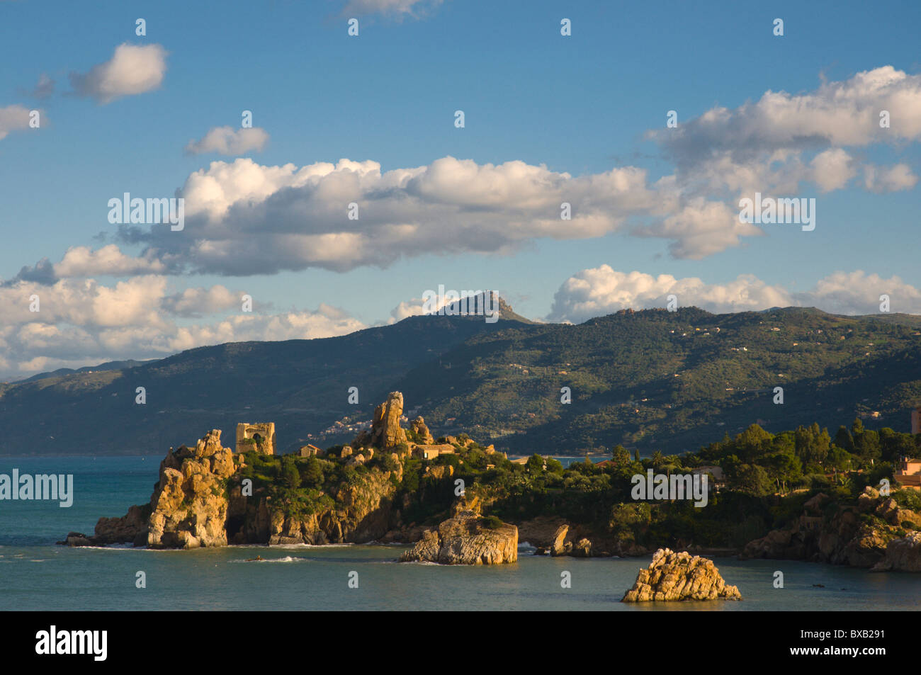 Rocks and ancient ruins on the Tyrrhenian coast at Cefalu town Sicily Italy Europe Stock Photo