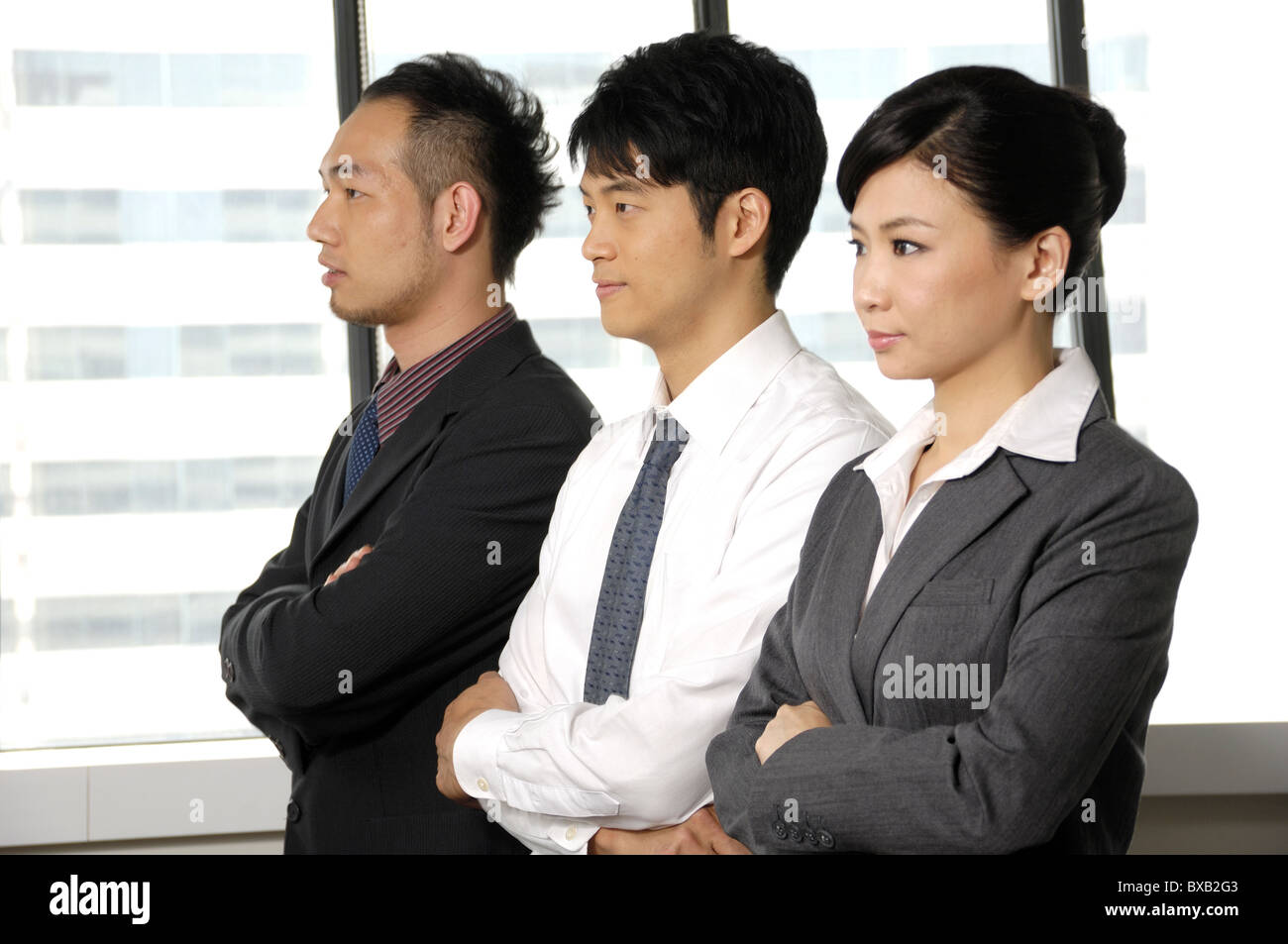 Executives standing in a row hi-res stock photography and images - Alamy