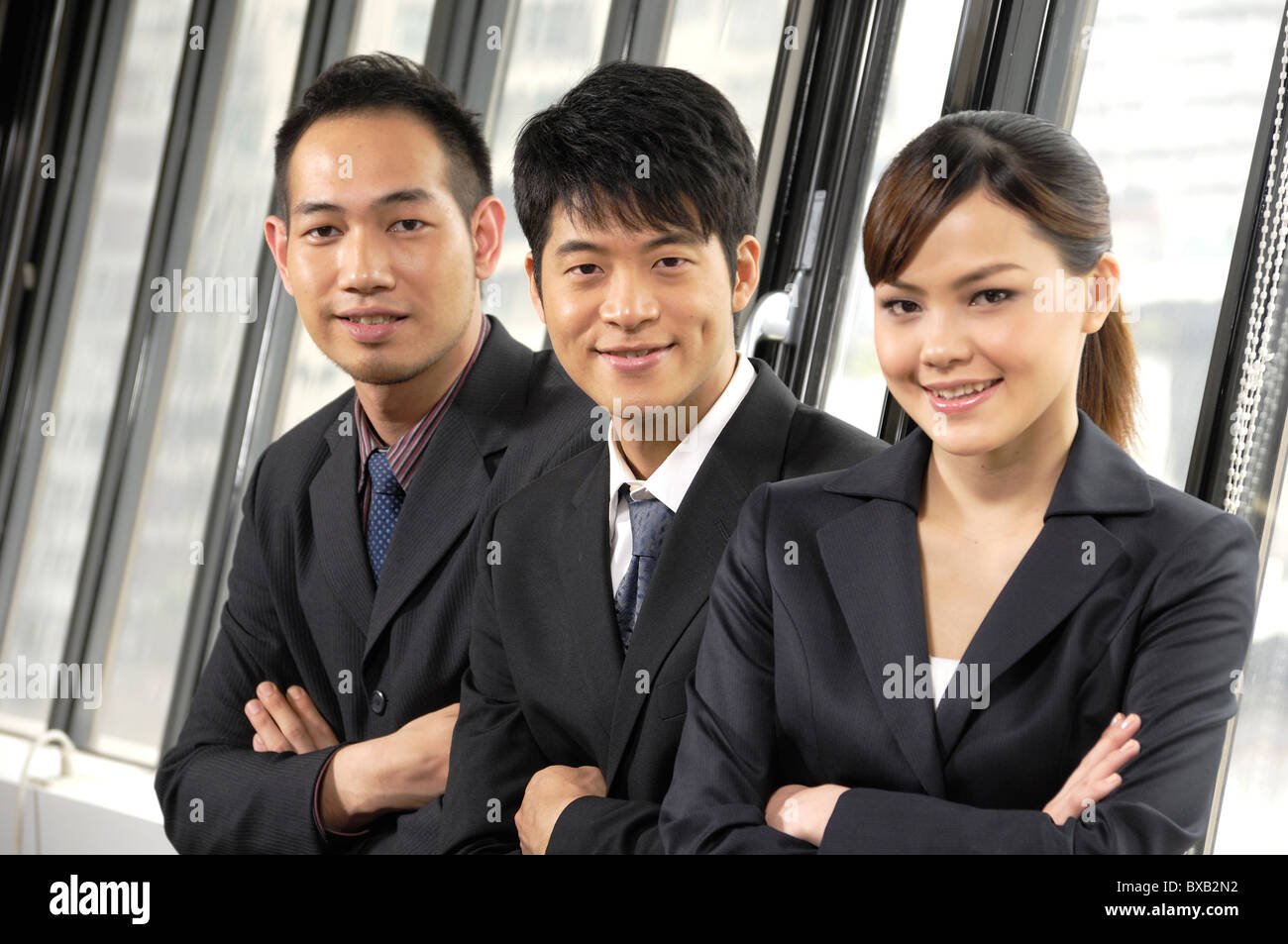 Business executives standing in a row in an office Stock Photo - Alamy