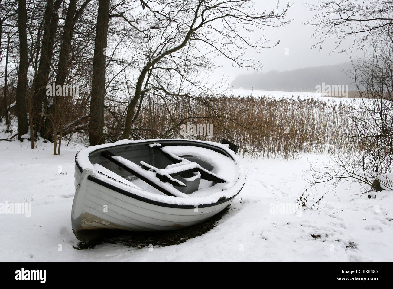 Sjælsø lake in Denmark, boat in snow Stock Photo