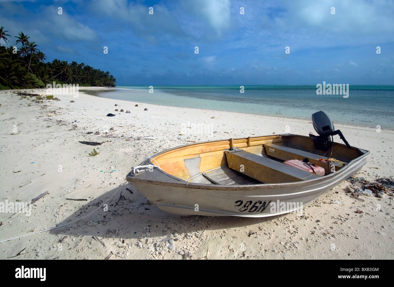 Small aluminium boat on beach at Scout Park, West Island, Cocos Keeling lagoon, Indian Ocean. No PR Stock Photo