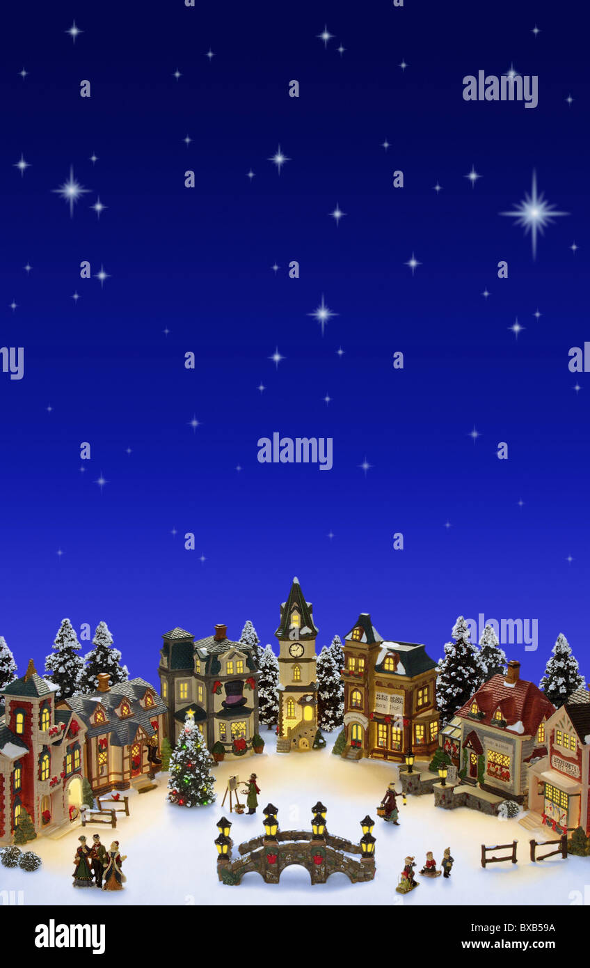 Christmas Village with snow and stars. Room for copy space Stock Photo