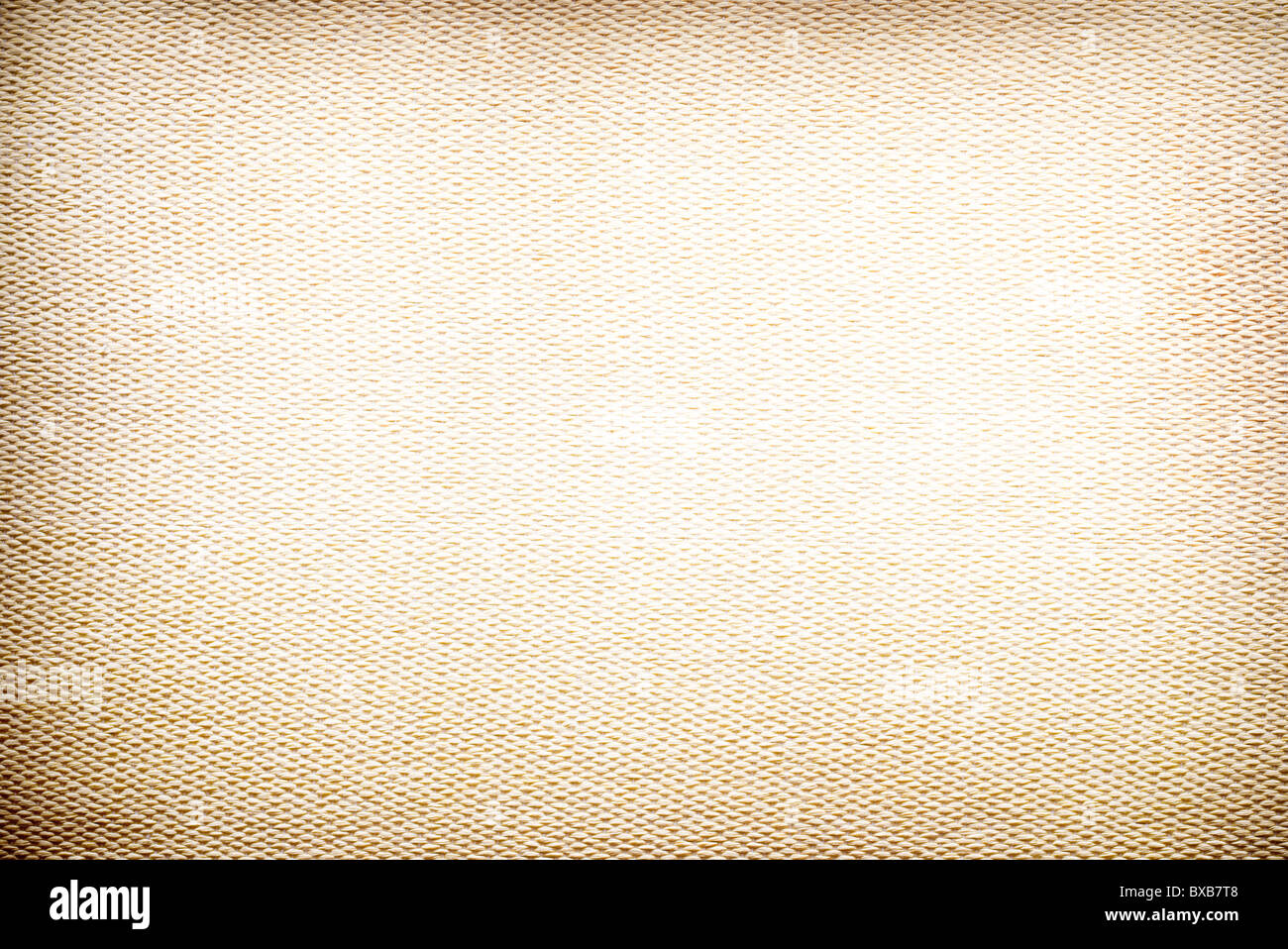 texture of the yellow fabric close up. Edges of the image blacked. Stock Photo