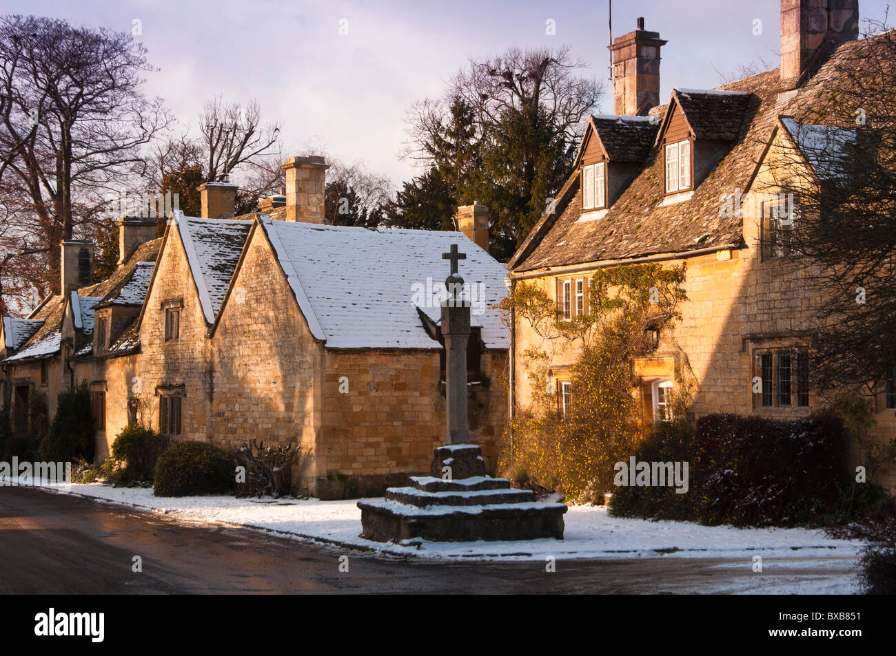 The cross outside Cross Cottage in the Cotswold village of Stanton, Gloucestershire, England Stock Photo
