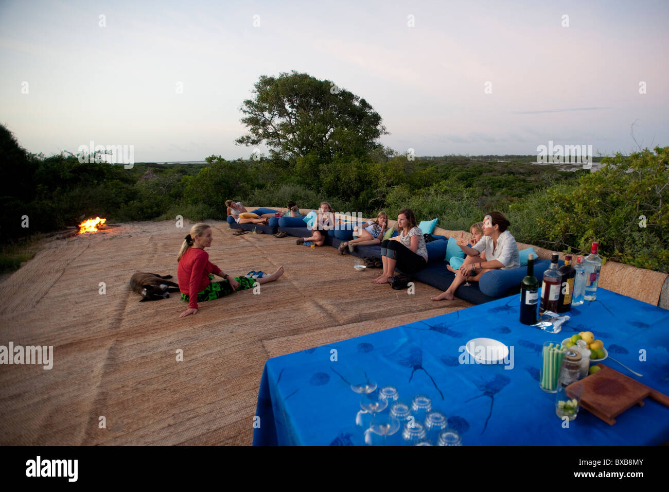 Tourists on lounge chairs at Manda Bay Resort in Kenya Africa Stock