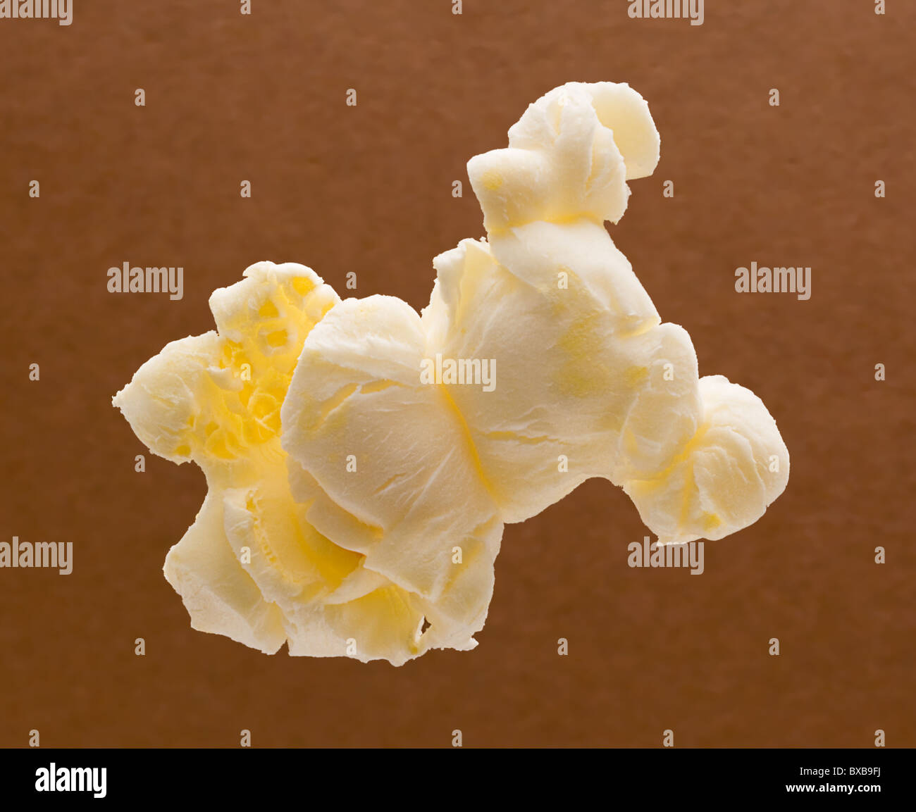 Popcorn isolated on a brown background Stock Photo
