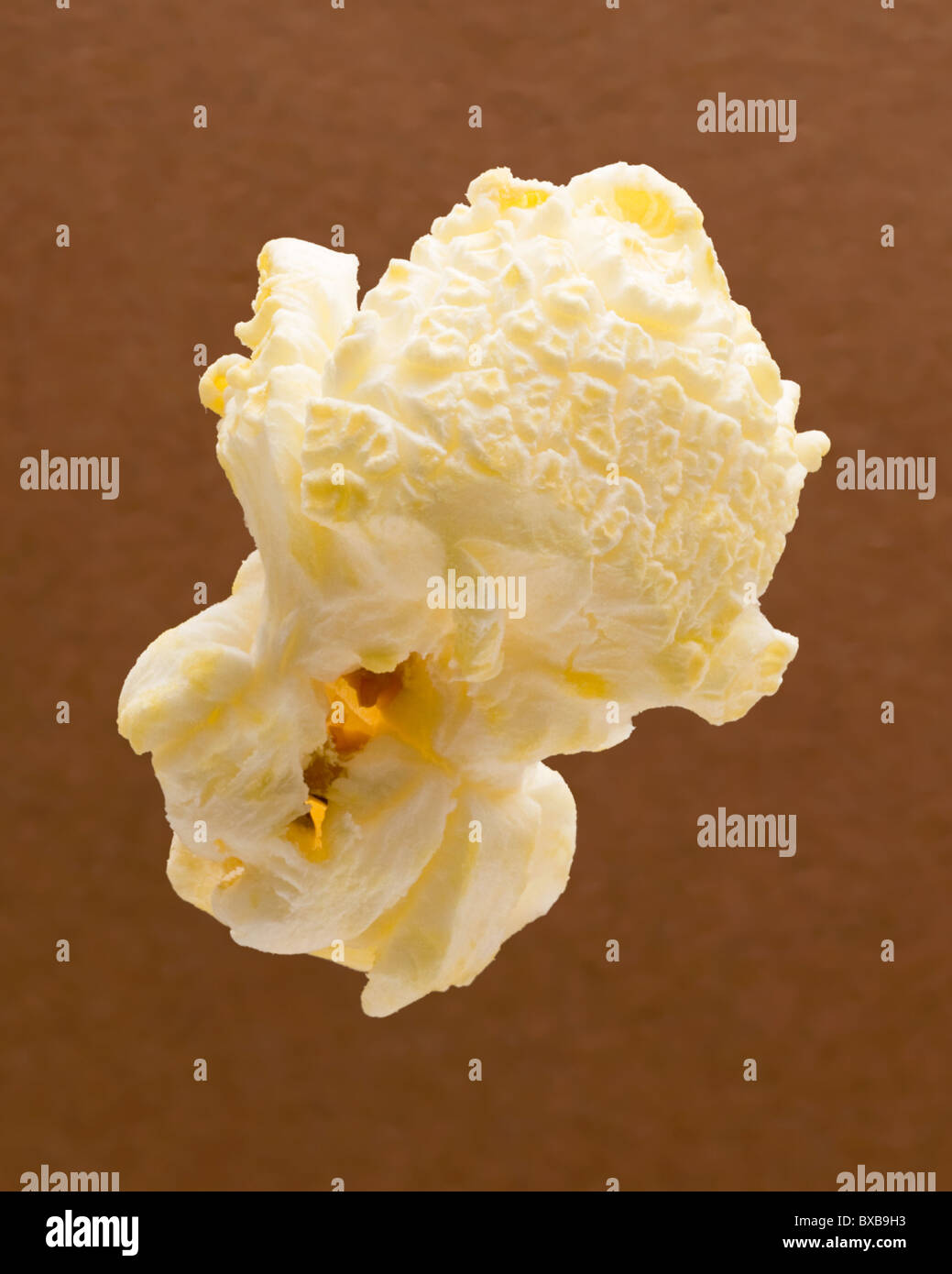 Popcorn isolated on a brown background Stock Photo