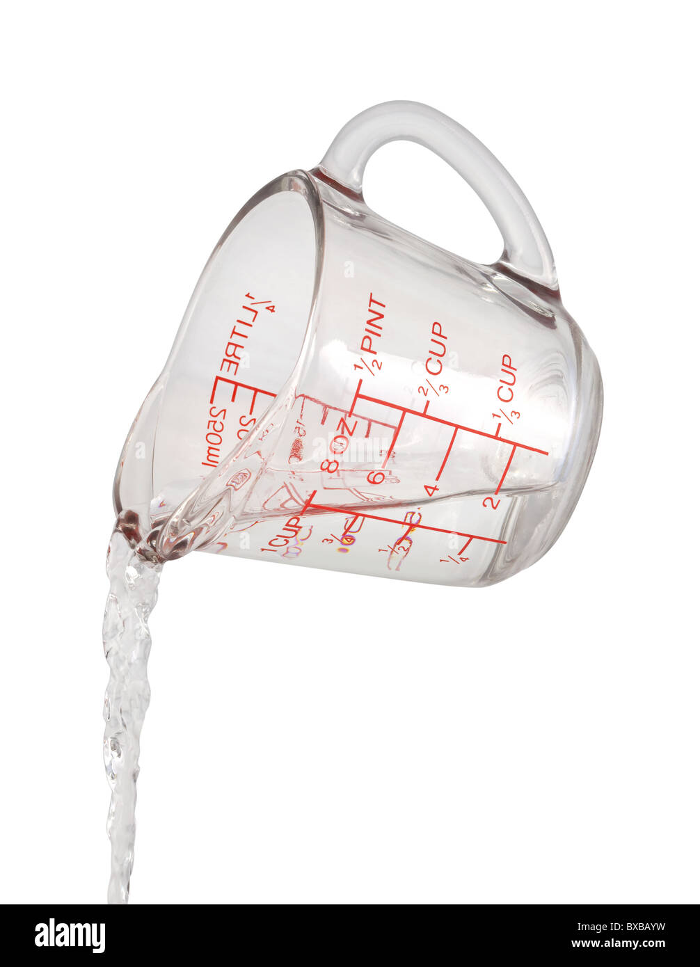 Water Pour from a Measuring Cup isolated on white Stock Photo