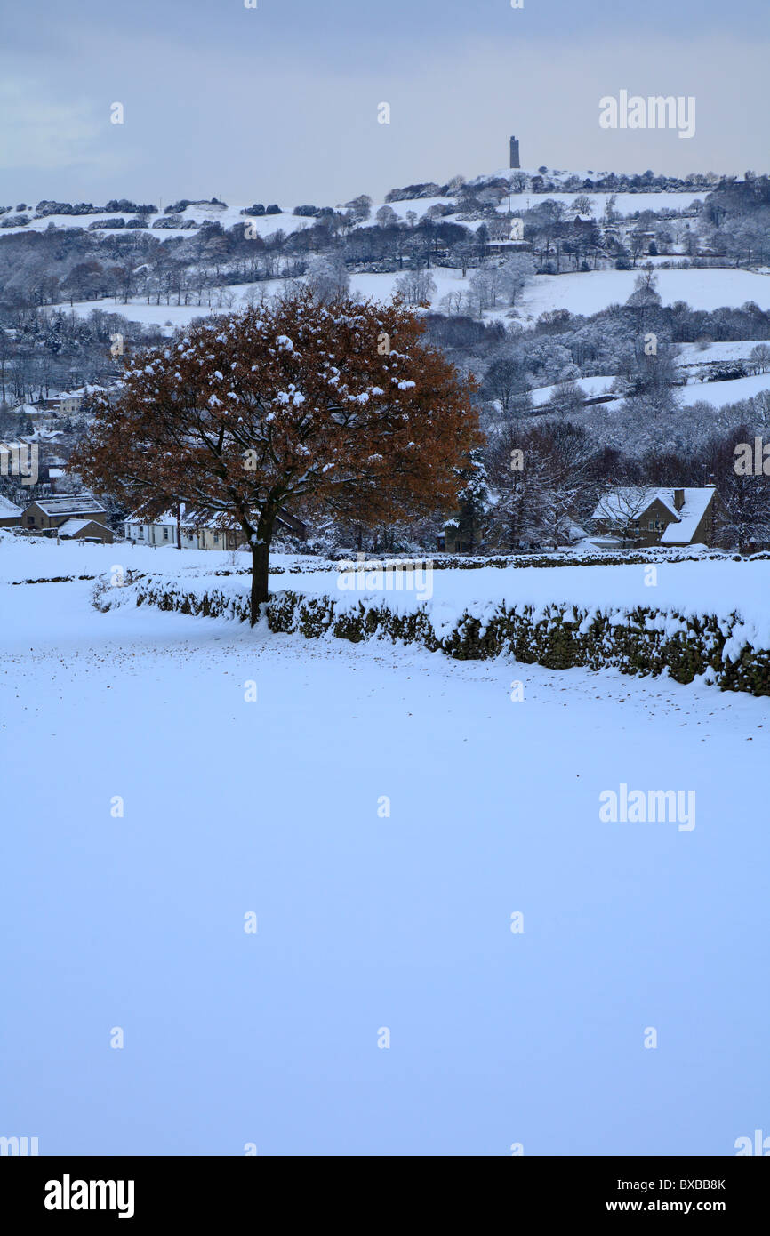 Snow in Honley fields and distant Jubilee Tower on Castle Hill, Huddersfield, West Yorkshire, England, UK. Stock Photo
