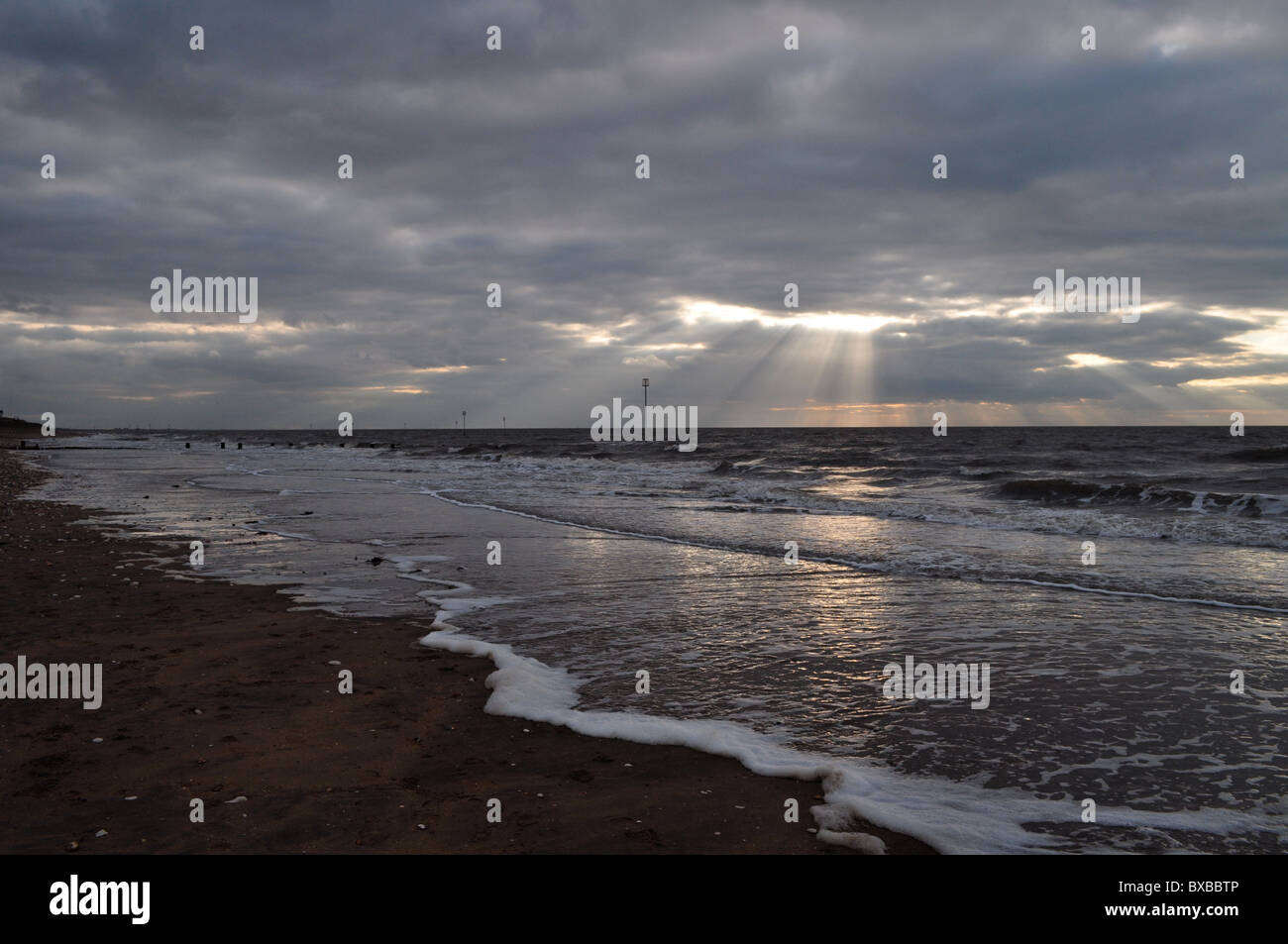 Cold light breaks through clouds on North Sea Stock Photo