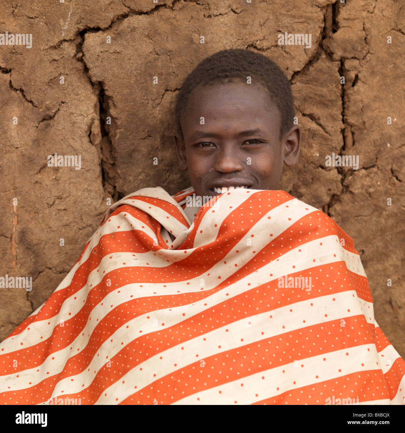 African man in a stripped blanket Stock Photo Alamy