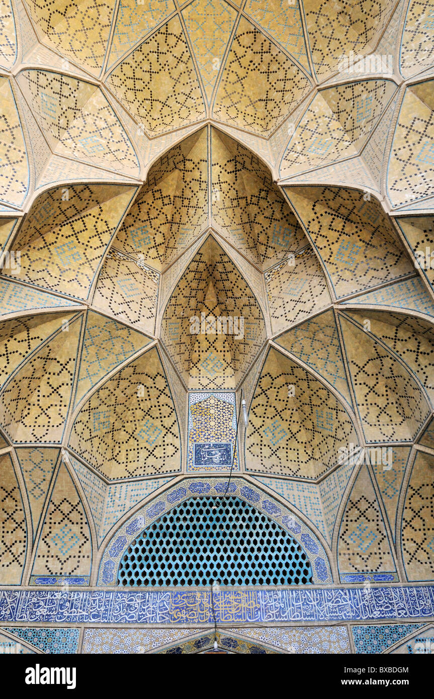 Finely decorated ceiling in the Iwan of the historic Friday or Congregational Mosque, Isfahan, Esfahan Stock Photo