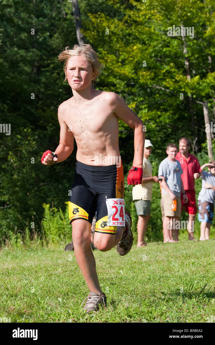 Young boy kid running triathlon race Stock Photo 