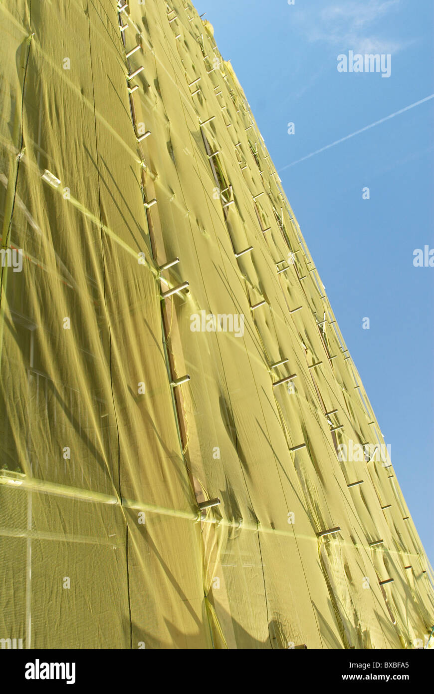 Protective sheeting covering scaffolding East London UK Stock Photo