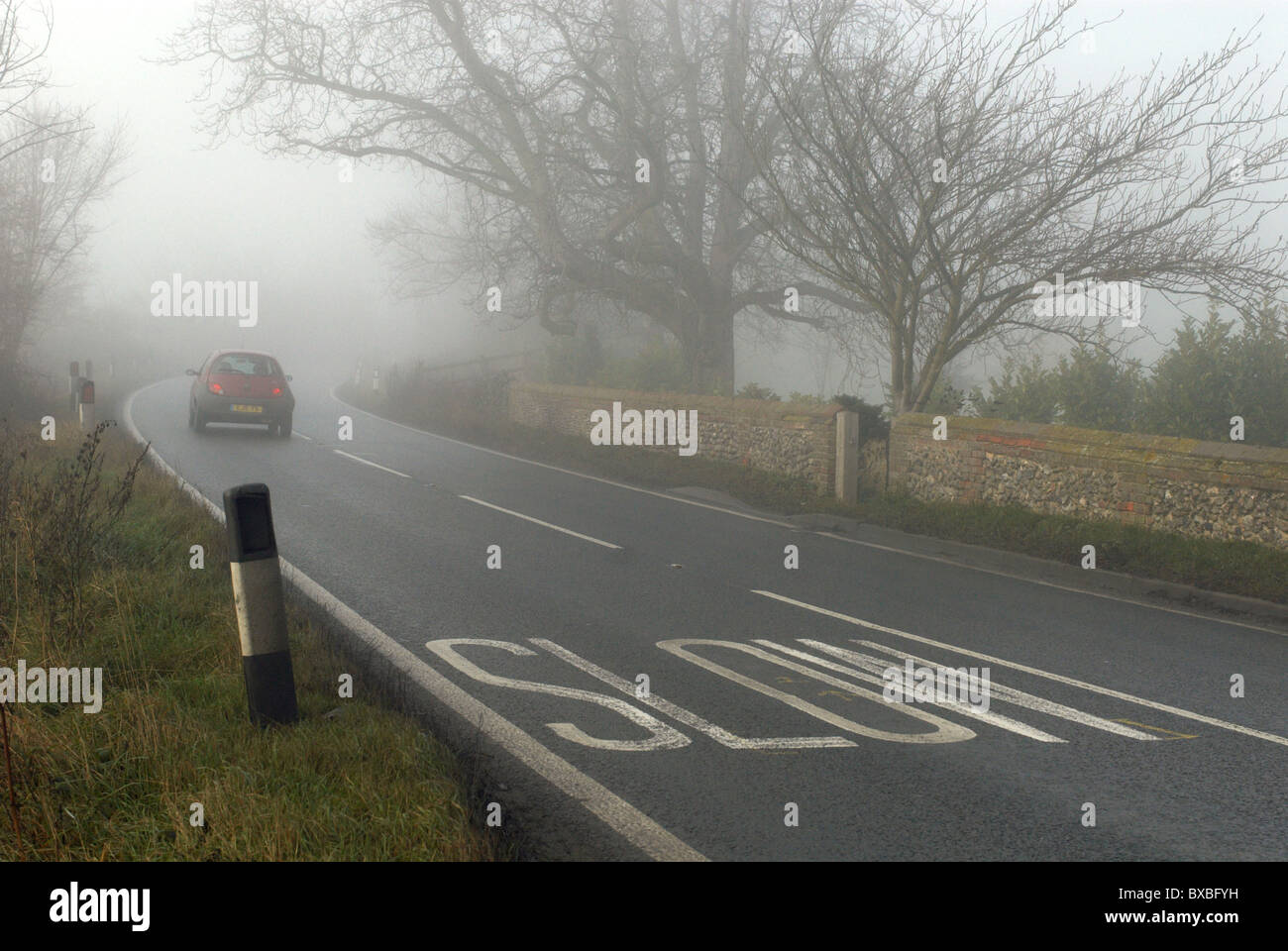 Car driving in fog UK Stock Photo Alamy