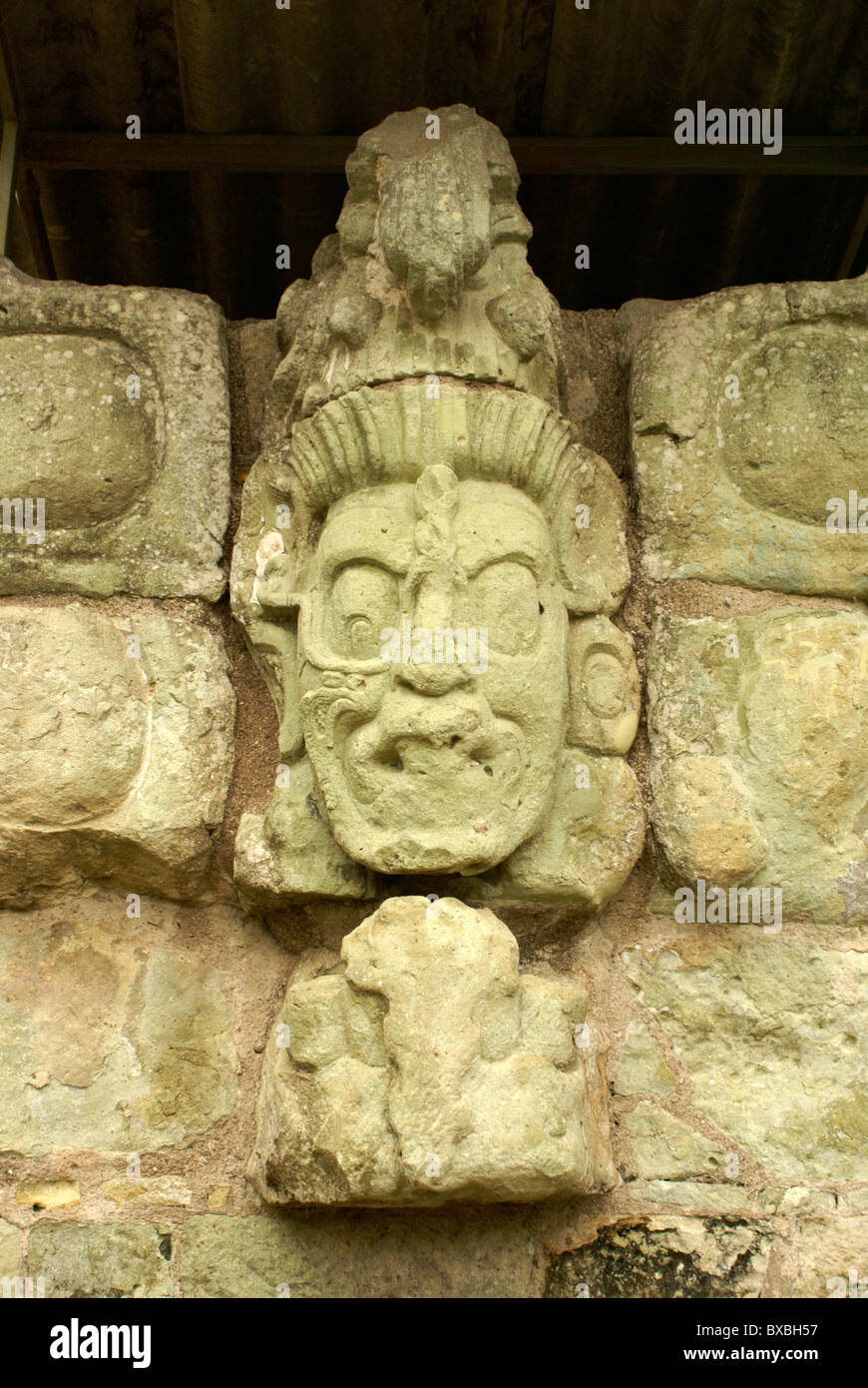 Sculpted Mayan Jaguar Sun God face on the wall of the East Court, Copan, Honduras. Copan is a UNESCO World Heritage Site. Stock Photo