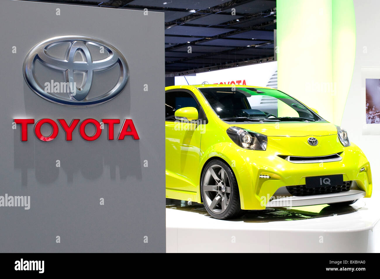 Logo of the Toyota auto maker with a IQ compact car at the 63. Internationale Automobilausstellung International Motor Show IAA Stock Photo