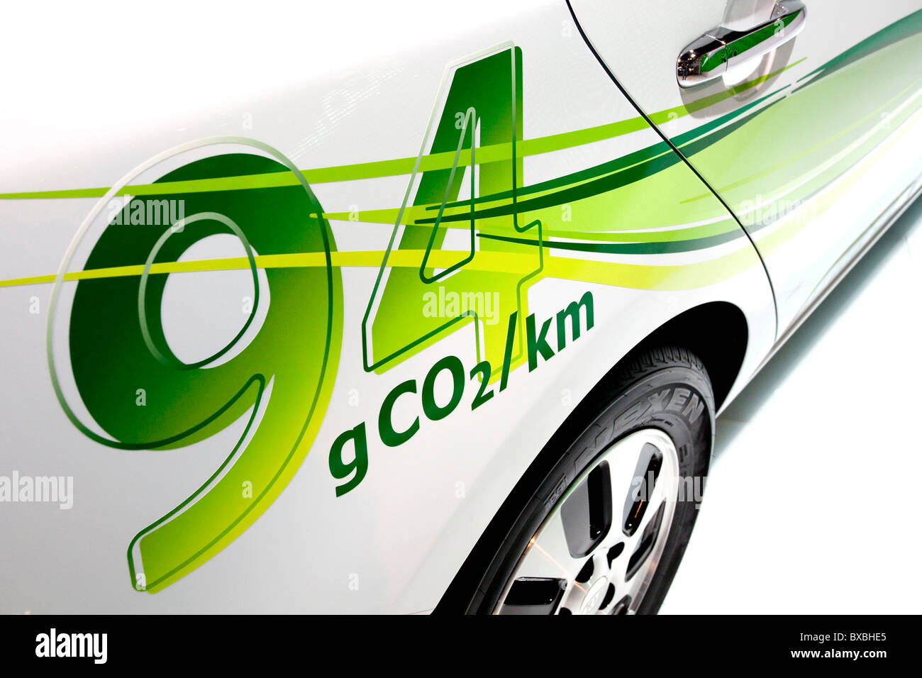Lettering 94 grams of CO2 emissions on a Kia Motors vehicle at the 63. Internationale Automobilausstellung International Motor Stock Photo