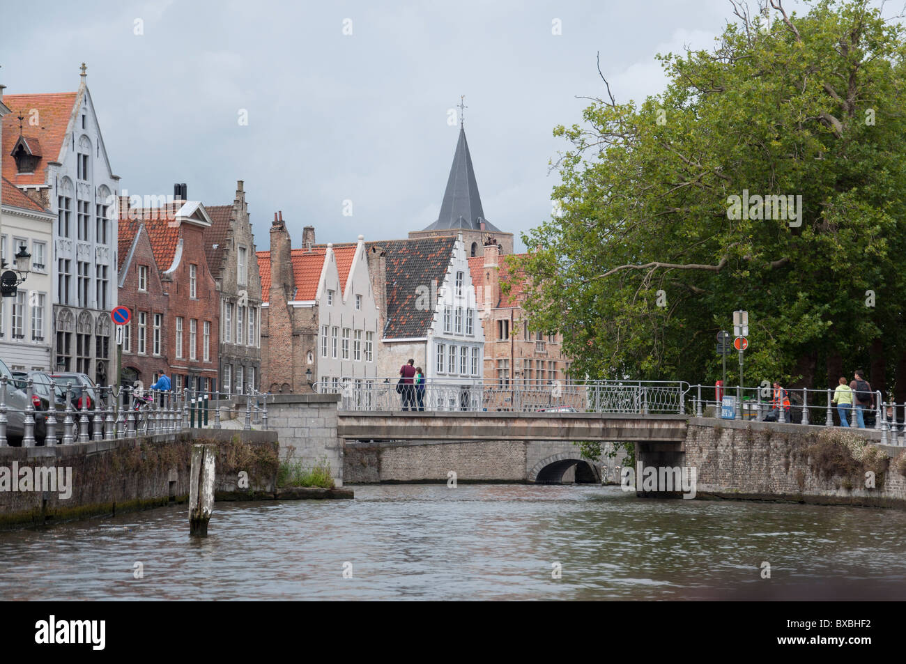 Some of the buildings in Bruges, Belgium as seen from a canal cruise boat on a canal. Stock Photo