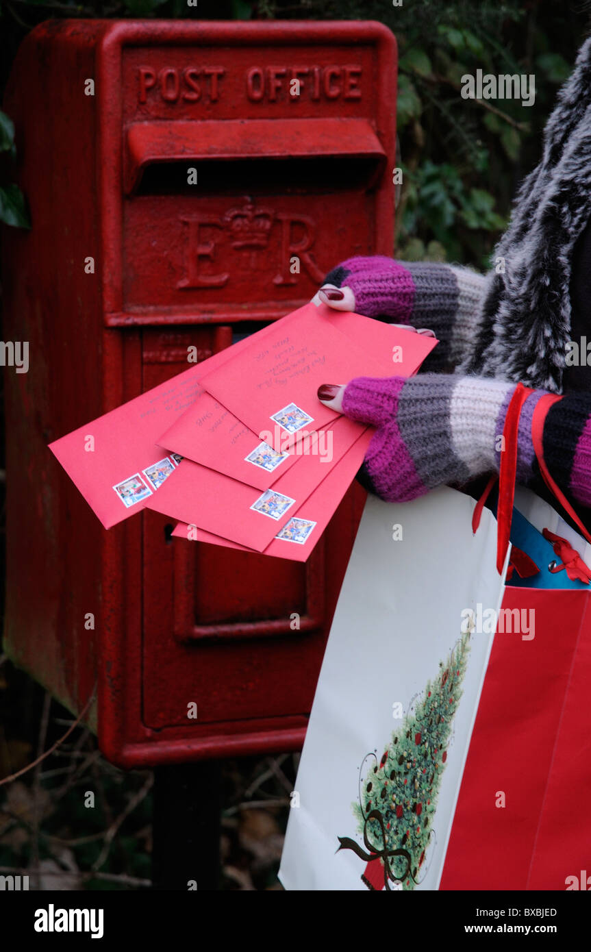 Final posting days before Christmas woman posting her greetings cards