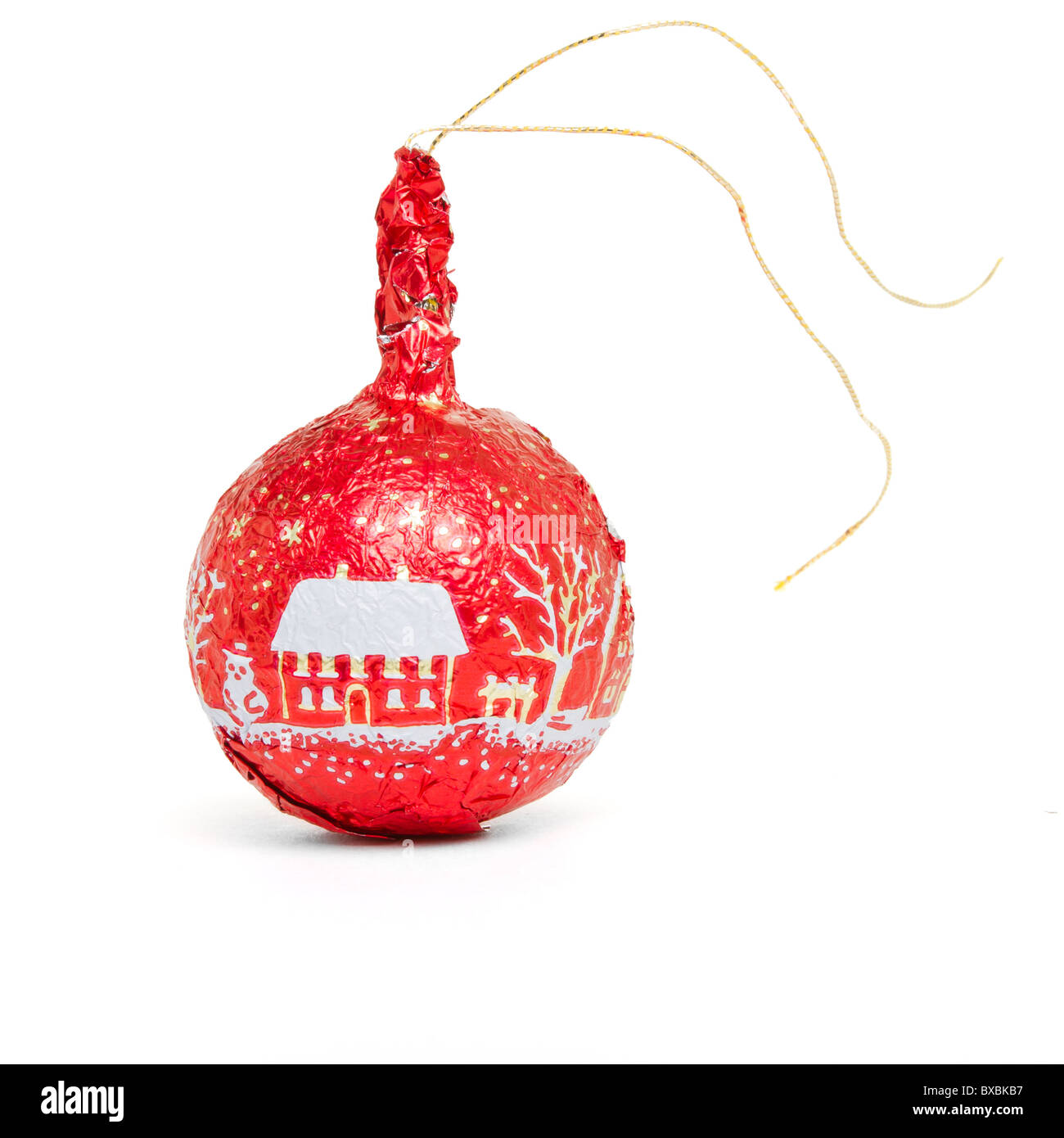 Red foil wrapped Chocolate Bauble xmas tree decoration isolated on white. Stock Photo