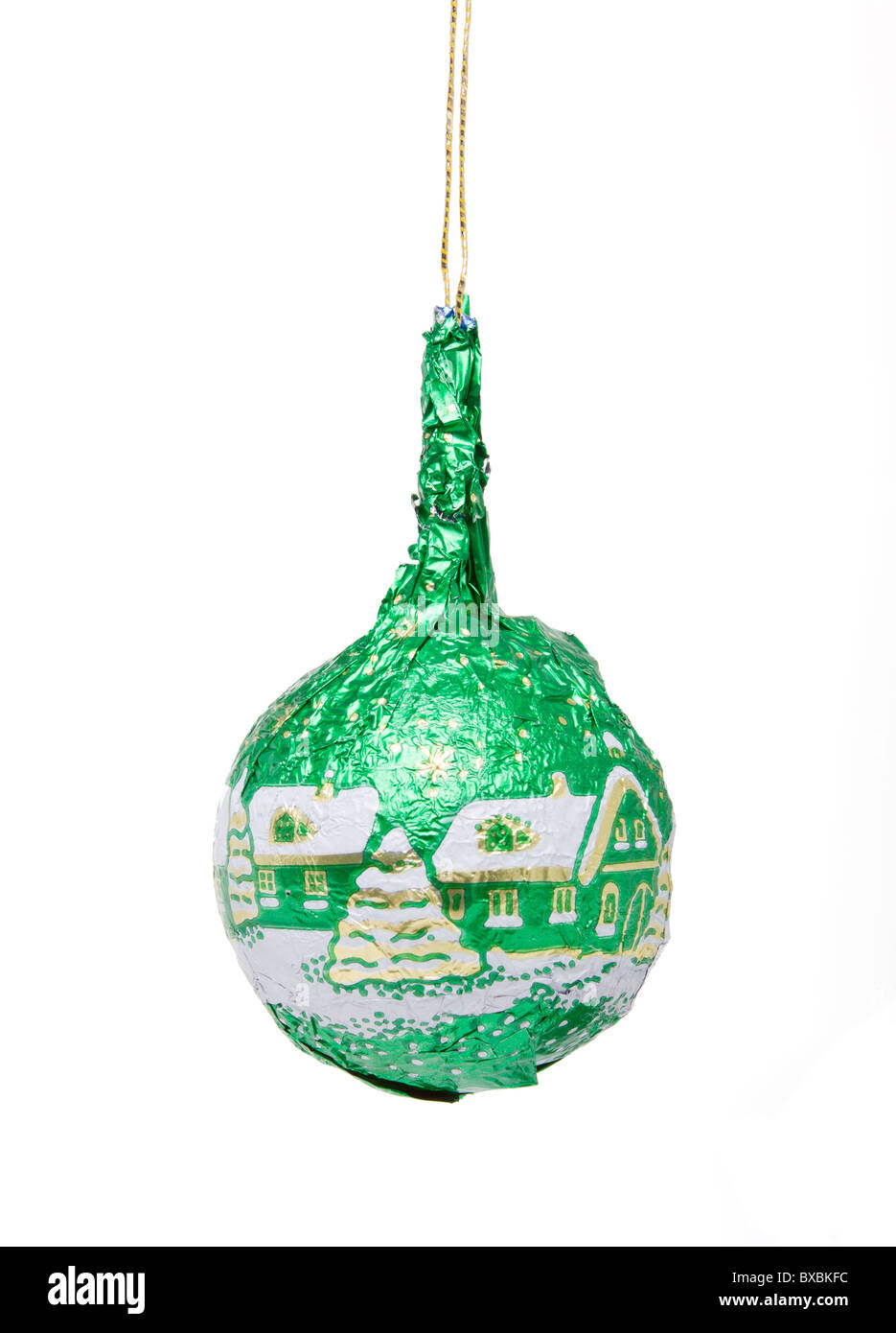 Green foil wrapped Chocolate Bauble xmas tree decoration isolated on white. Stock Photo