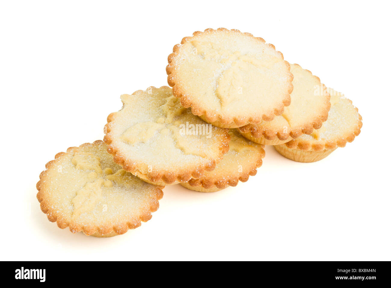 Stack of sweet mince pies from low perspective isolated on white. Stock Photo