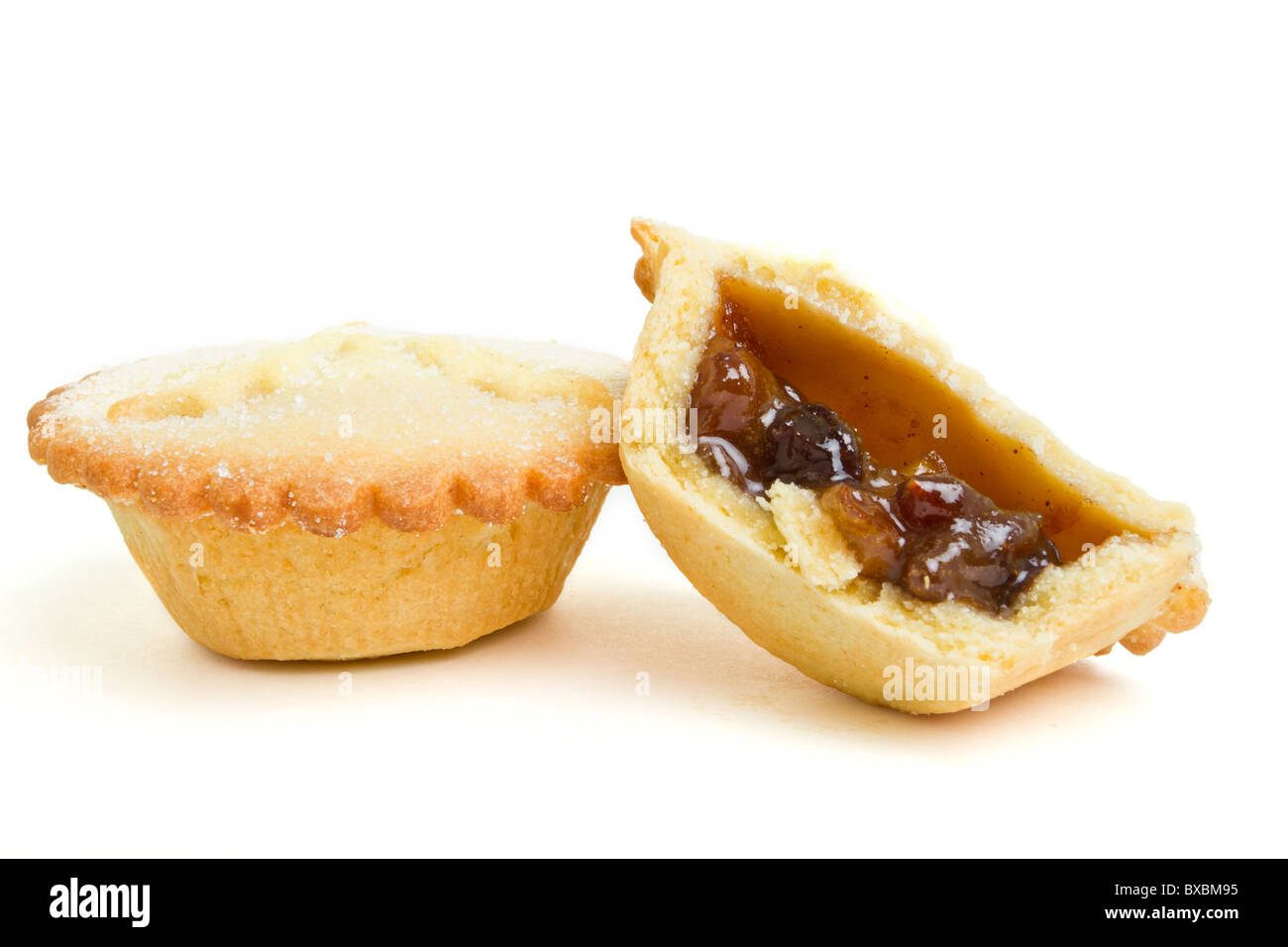 Festive sweet mince pies from low perspective isolated on white. Stock Photo